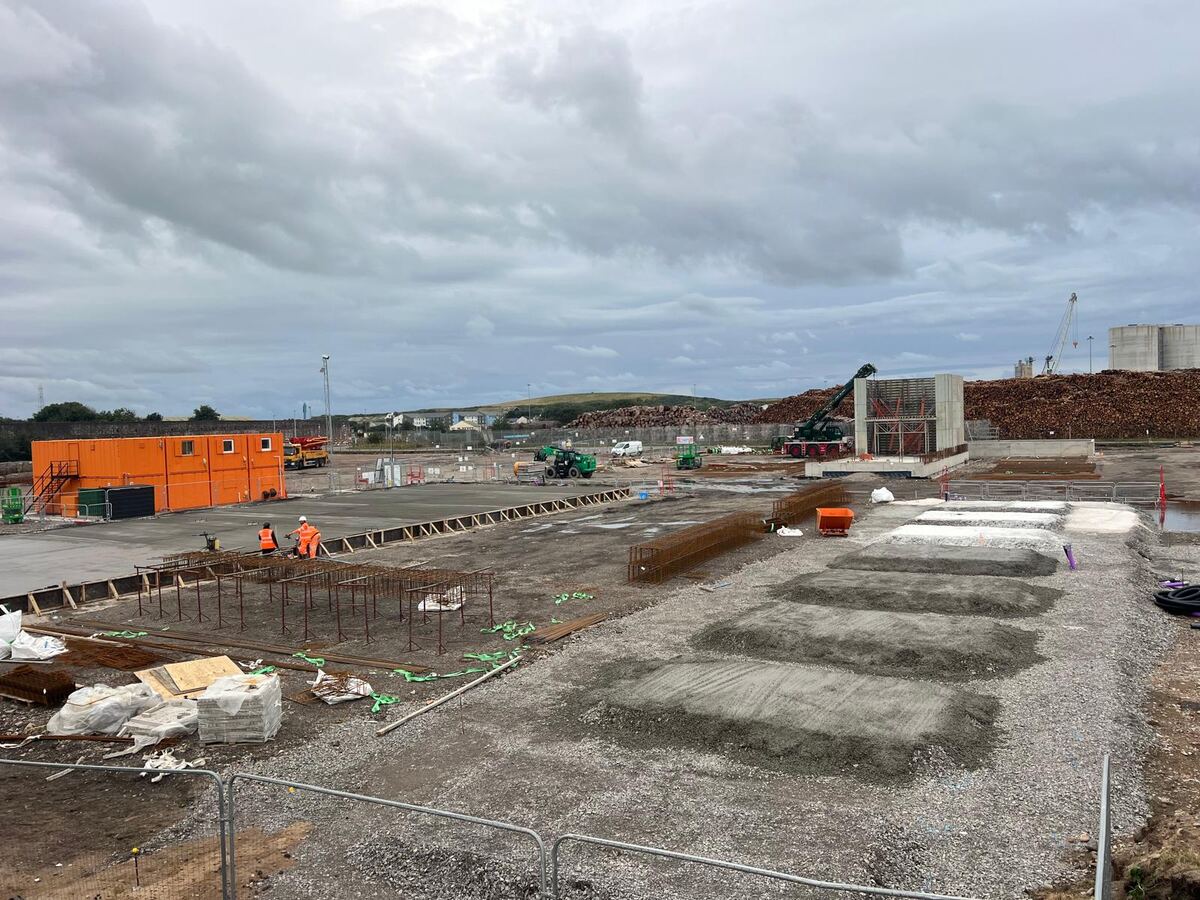 Row of poured pad foundations on a prepared stone base