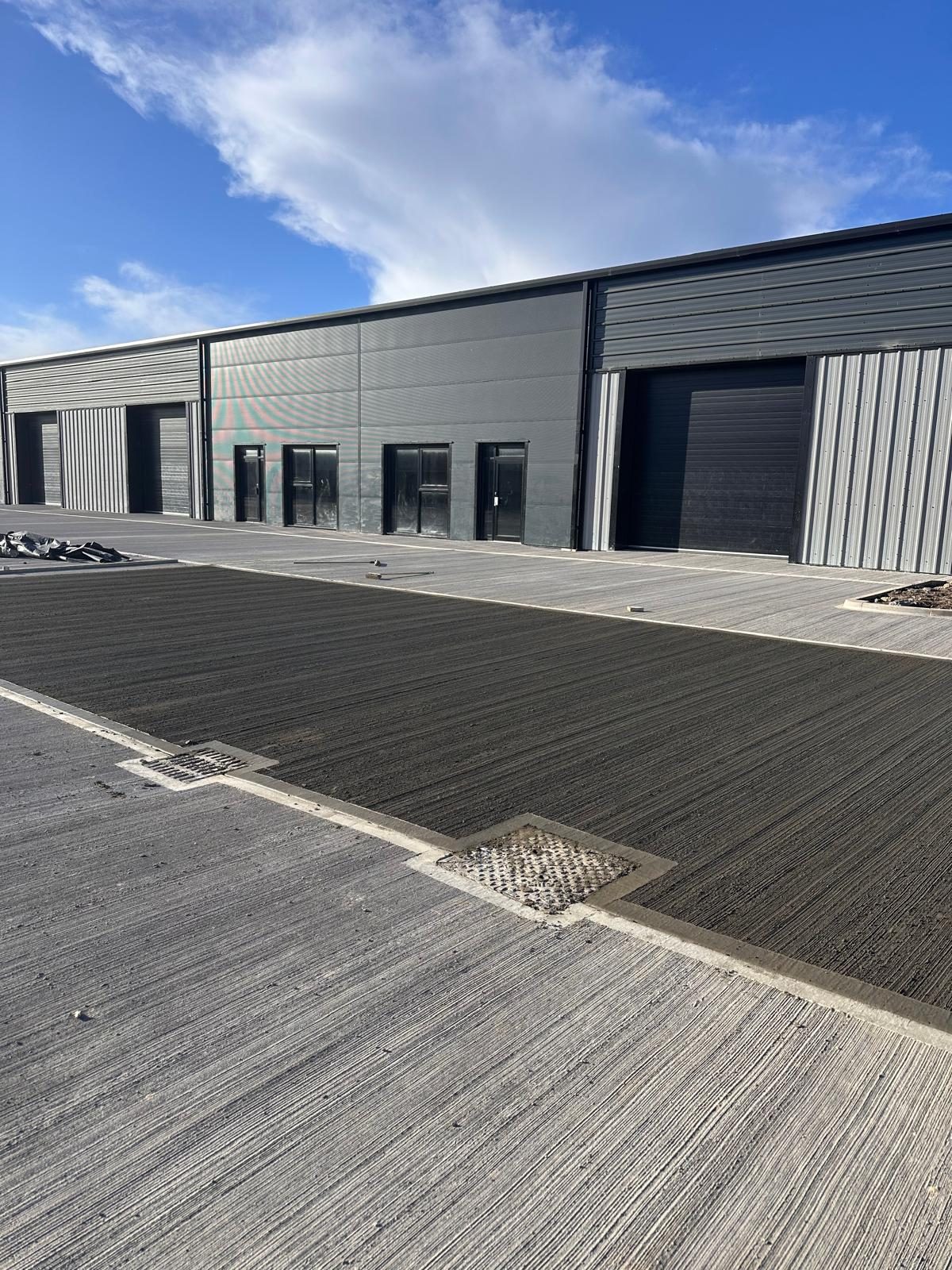 Textured external concrete apron in front of new industrial units