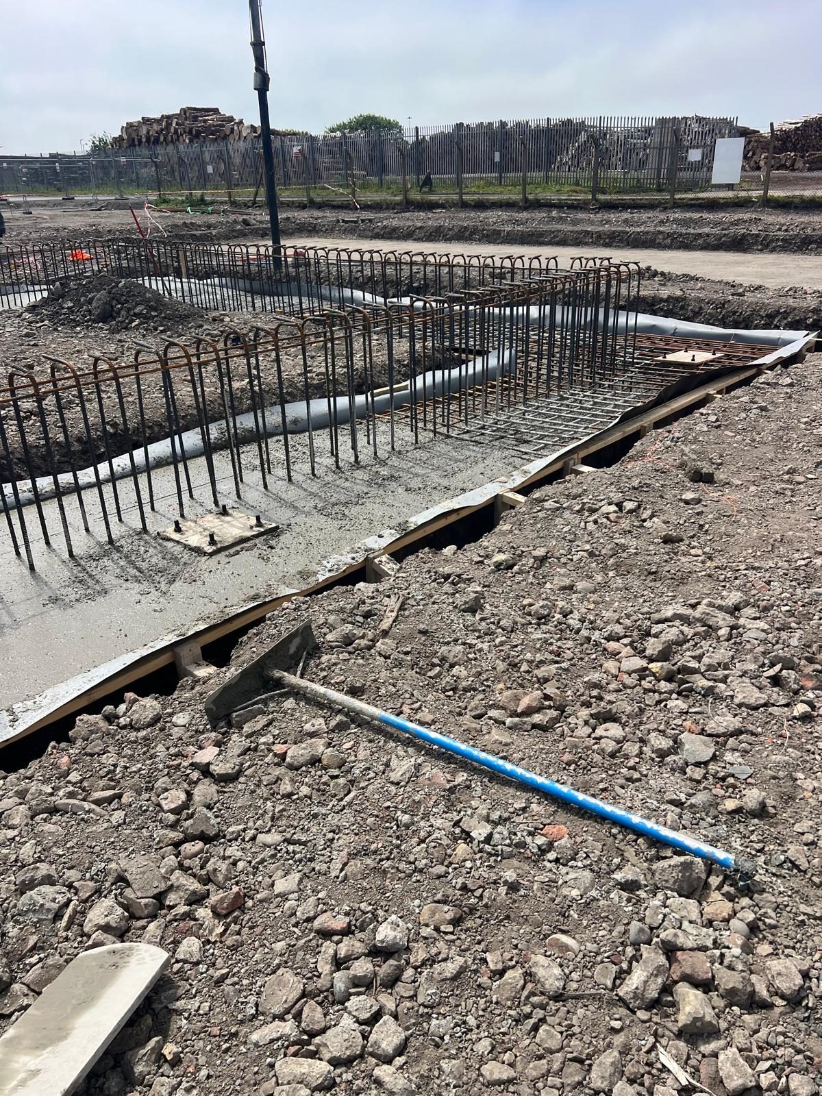 Ground beam reinforcement in place with a pump on site