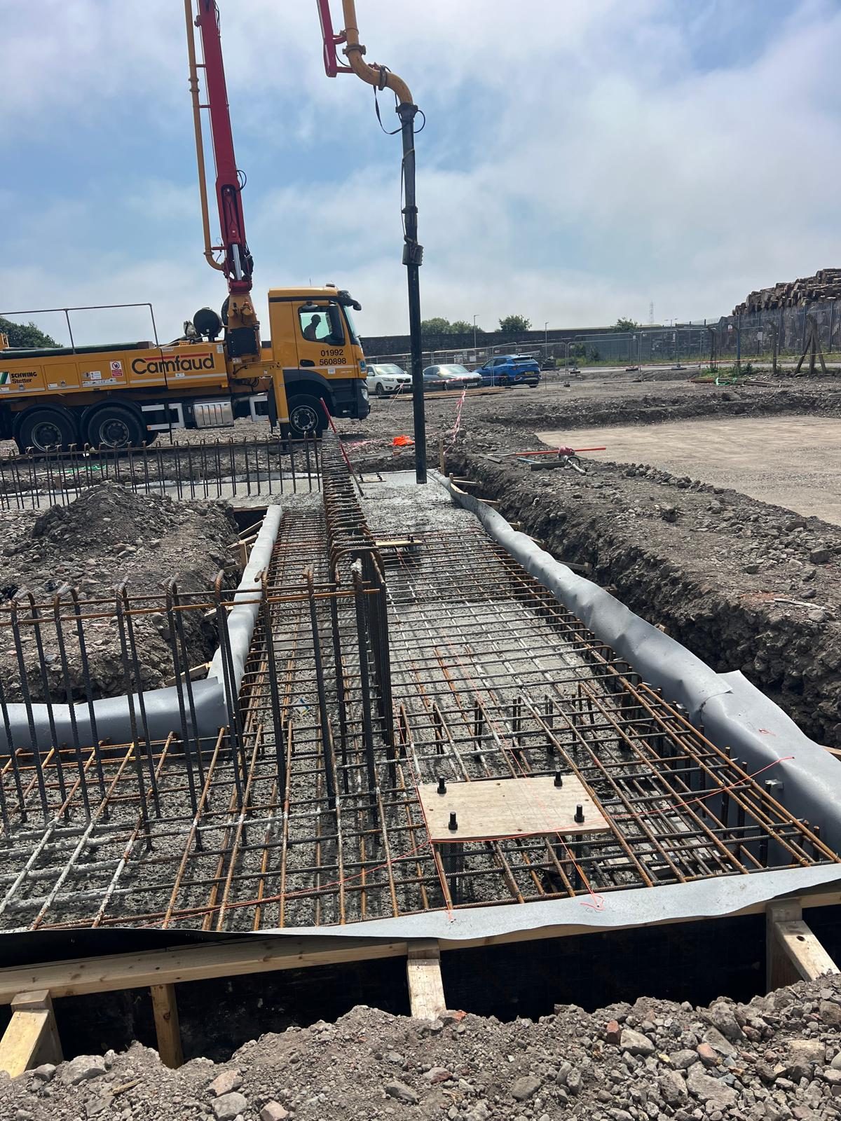 Boom pump over reinforced ground beams