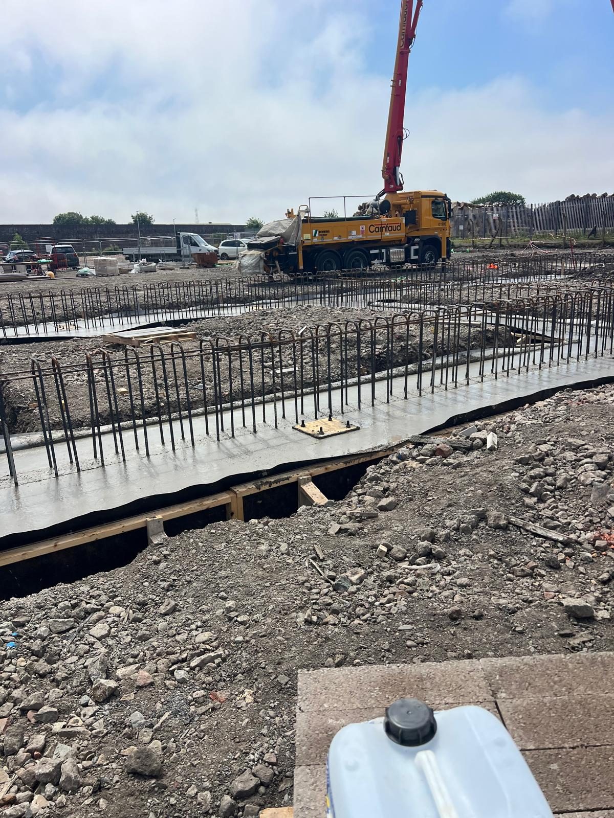 Ground beams with starter bars and a boom pump on site