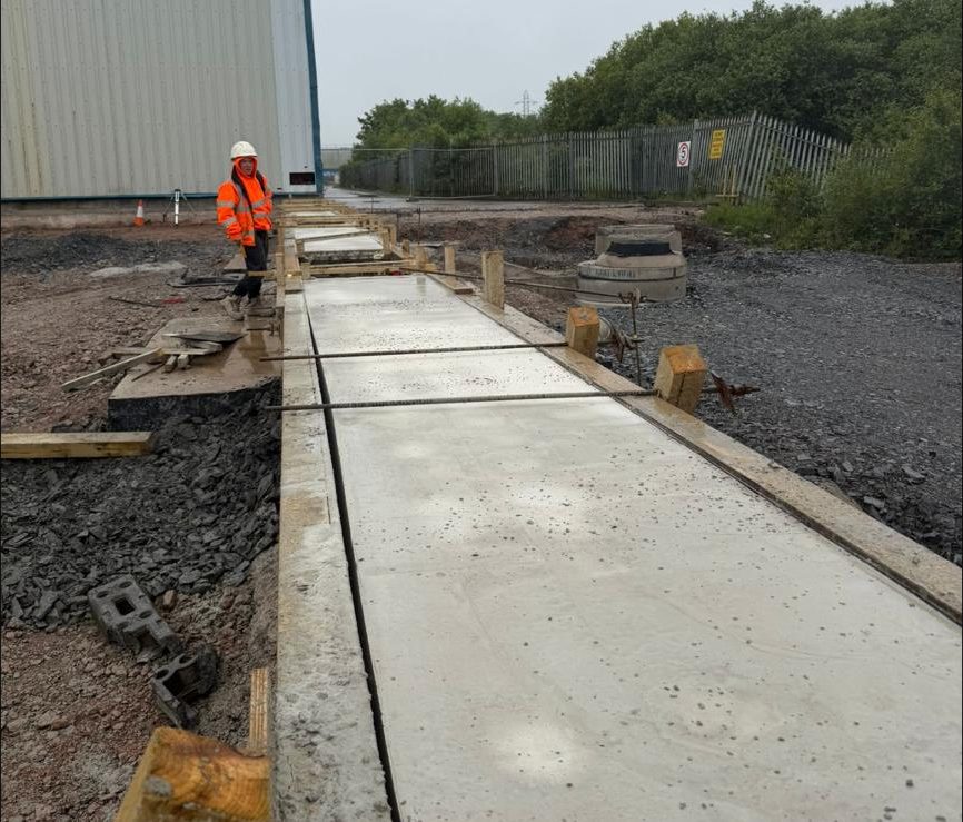 Concrete slab cast in bays alongside the building