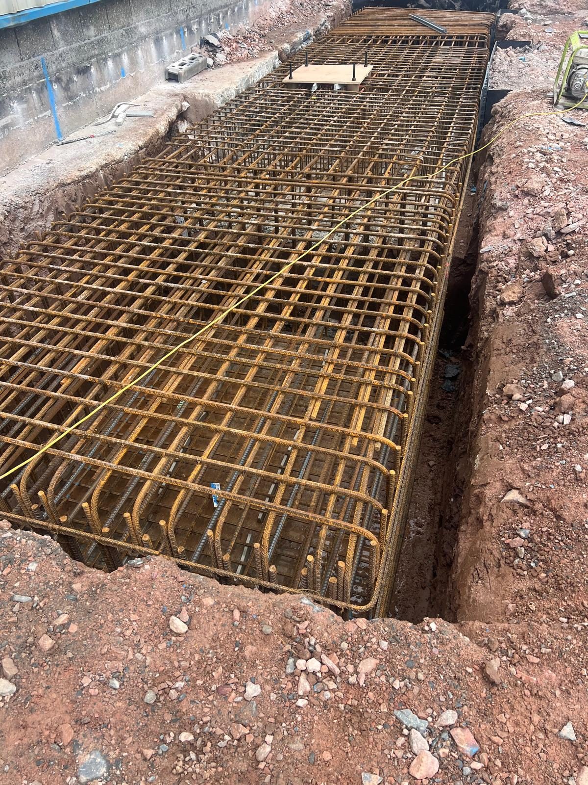 Reinforcement cage fixed in a deep foundation excavation