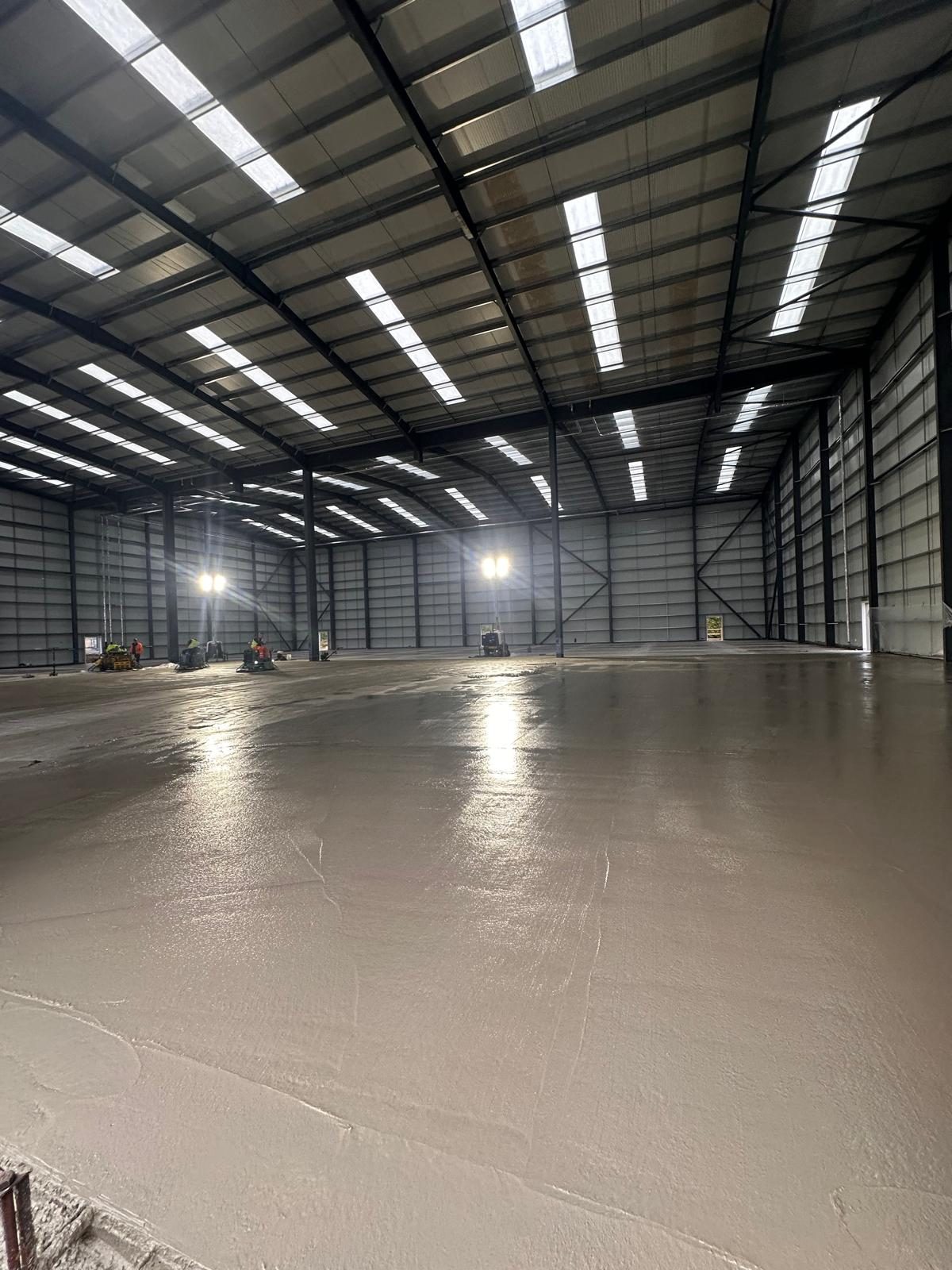 Freshly finished concrete floor inside a warehouse