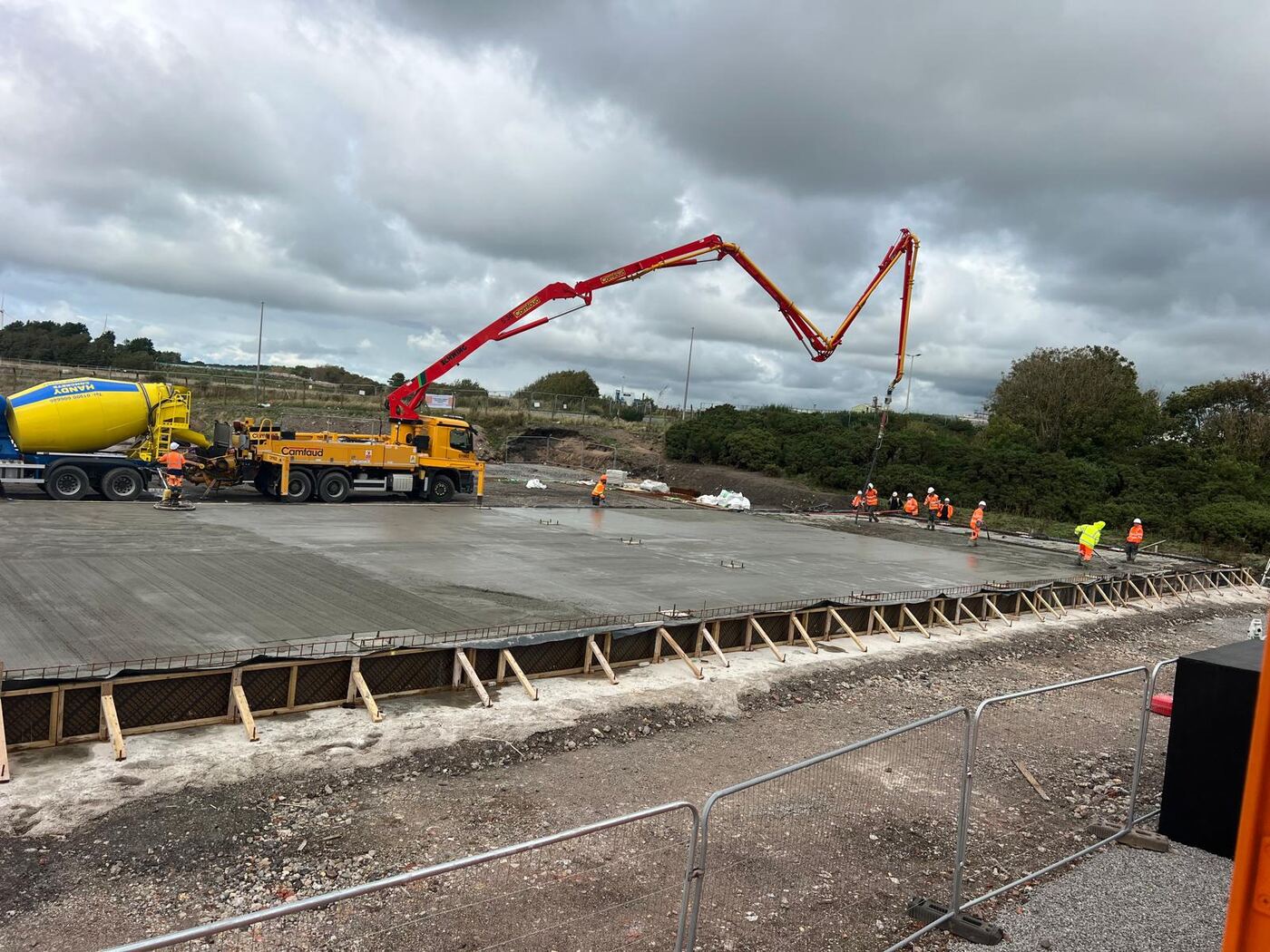 Large concrete slab pour placed by boom pump